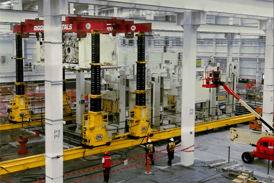 800 ton crown press assembly maneuver using 500 ton hydraulic frame.